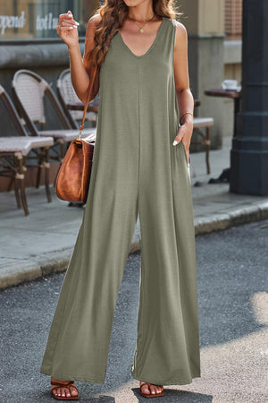Flowing palazzo jumpsuit in Matcha Green with V-neck and wide legs.
