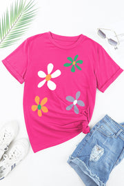 Hot pink t-shirt with a daisy graphic print, short sleeves, and a crew neck.