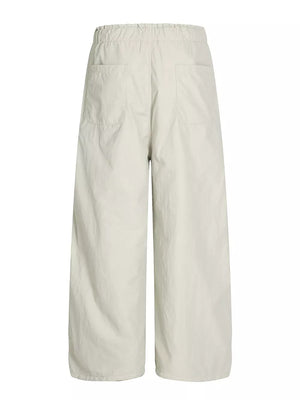 Men's light gray wide-leg sweatpants with elastic waist and two back pockets.