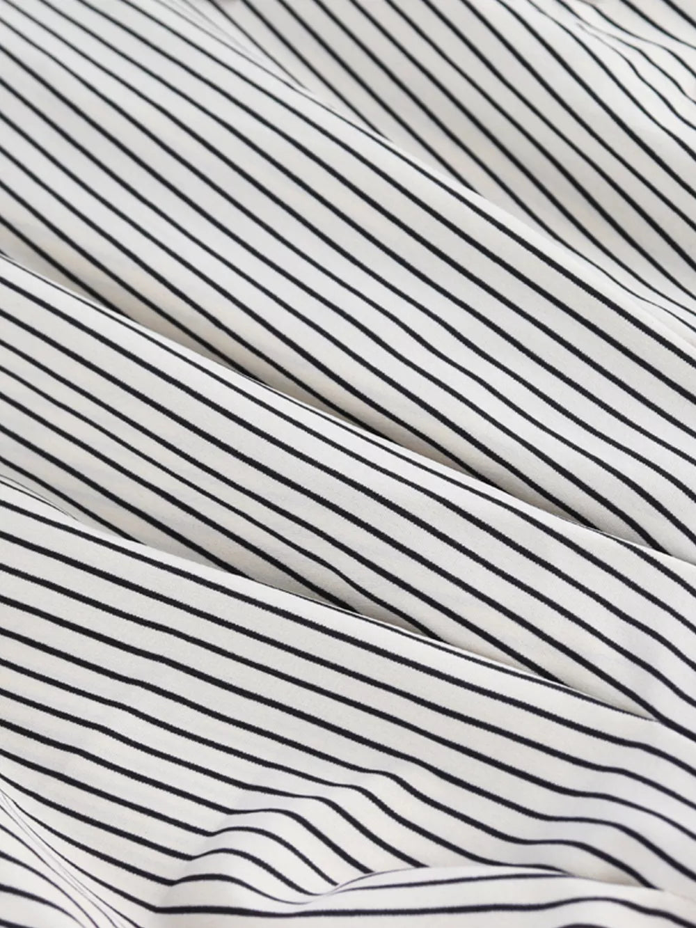 Black and white striped maternity shirt with cinched waist detail