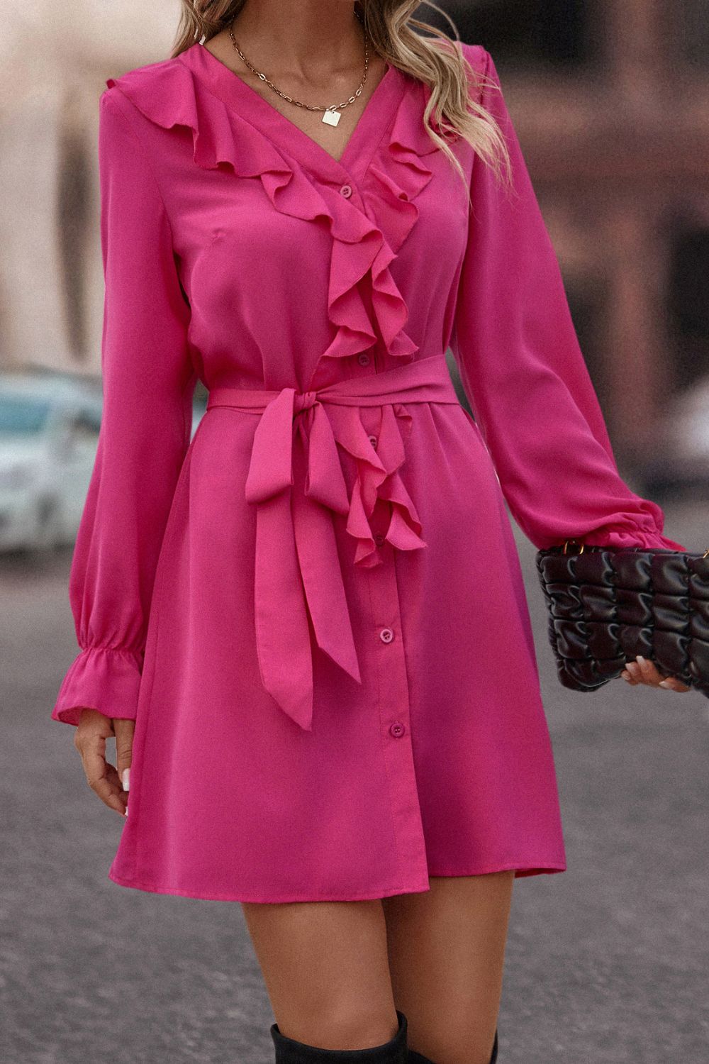 Magenta ruffled button-down A-line dress with tie belt and long sleeves.