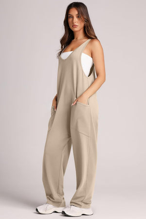 Khaki relaxed fit jumpsuit with oversized pockets and V-neck.