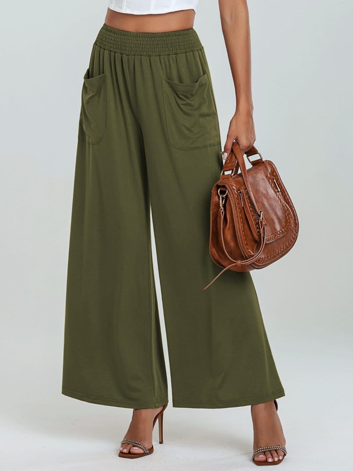 Moss green palazzo trousers with elastic waist and pockets, wide leg.