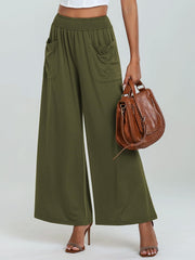 Moss green palazzo trousers with elastic waist and pockets, wide leg.