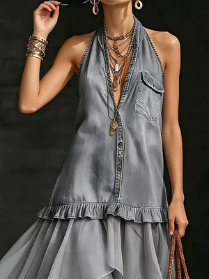 Grey ruffled halter maxi gown with button front and tiered skirt.