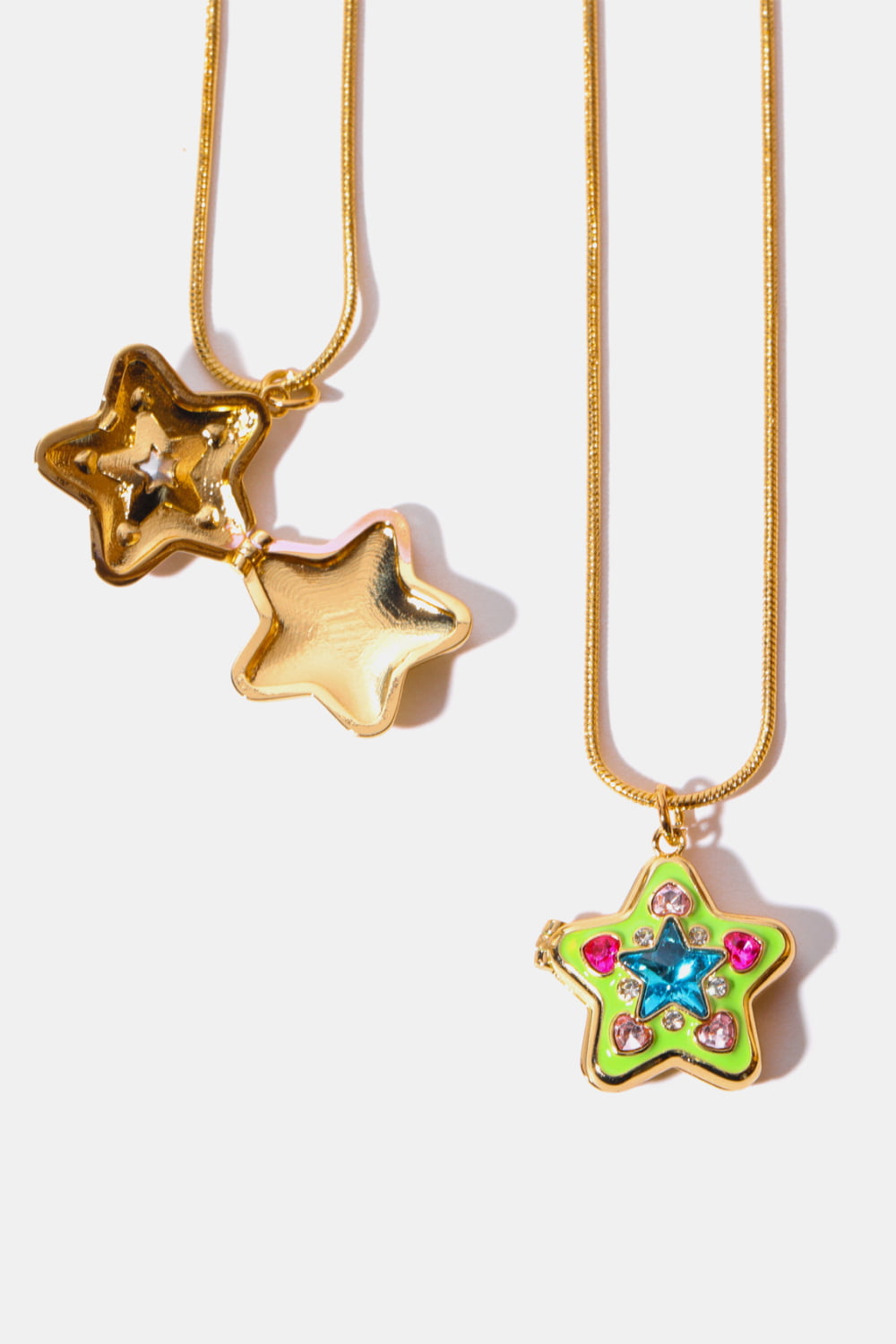 Locket starburst pendant necklace in yellow-green with pink and blue gems on gold chain