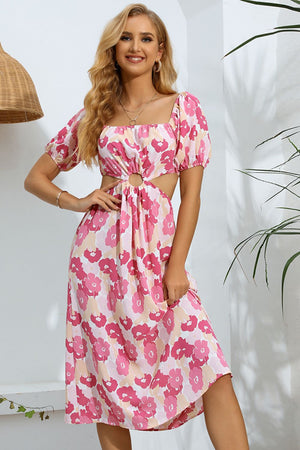 Pink floral midi dress with puff sleeves, square neckline, and cutout waist detail.