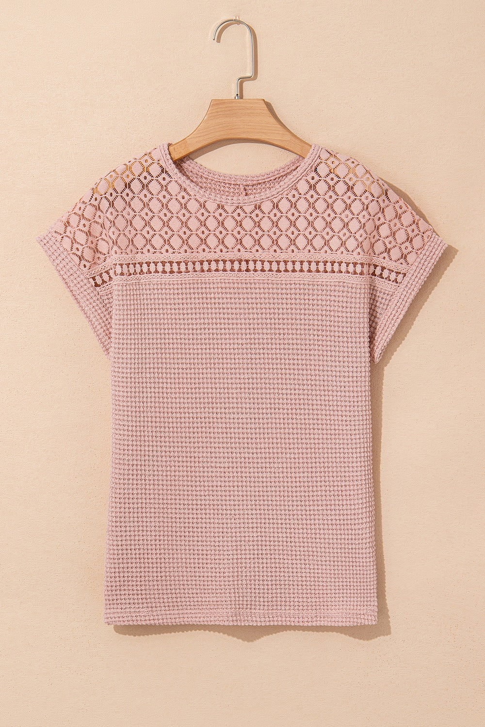 Dusty pink waffle knit top with short sleeves and a lace yoke detail.