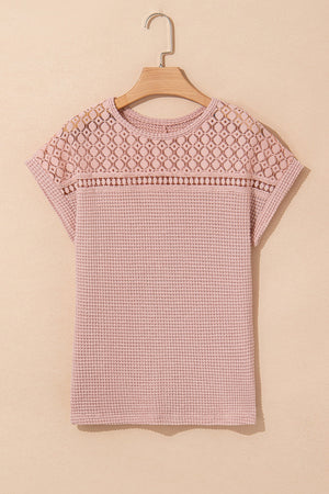 Dusty pink waffle knit top with short sleeves and a lace yoke detail.