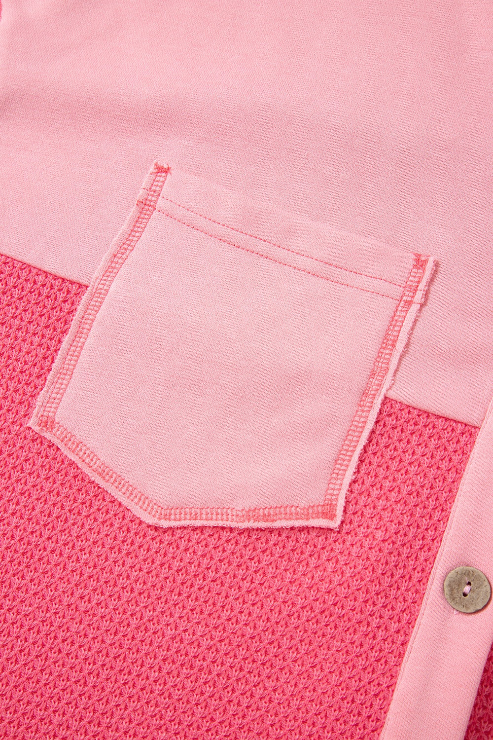 Blush pink waffle knit shacket with a chest pocket and button detail.
