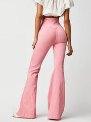 Flare denim jeans in watermelon pink with a high waist and asymmetric seam detail.