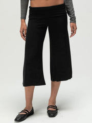Black relaxed wide leg capris with a foldover waistband and a cropped length.