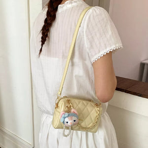 Quilted Chain Strap Crossbody Bag in Yellow, close-up detail