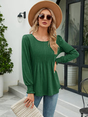 Green pleated bodice blouse with gathered sleeves and smocked cuffs