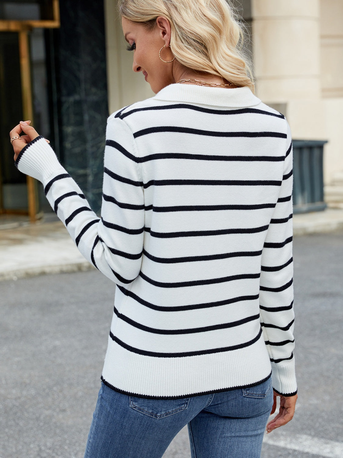 Polo-neck knit top with black and white Breton stripes, long sleeves, and ribbed cuffs.
