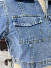 Light blue denim cropped jacket with a utility pocket and contrast stitching.