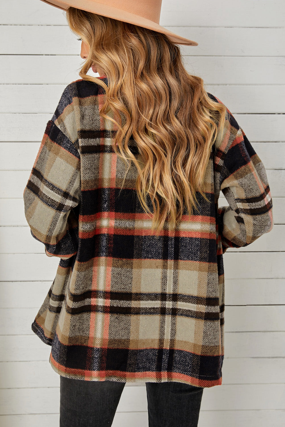 Relaxed plaid shacket with patch pockets in blue/orange and khaki tones.