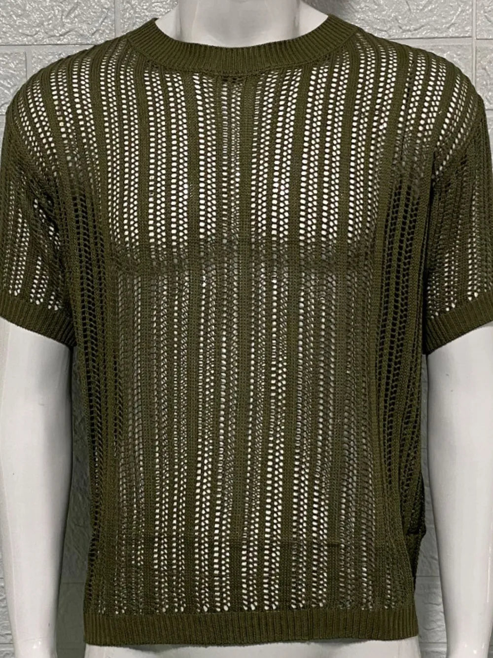 Open-knit boxy crew neck sweater in army green acrylic with short sleeves.