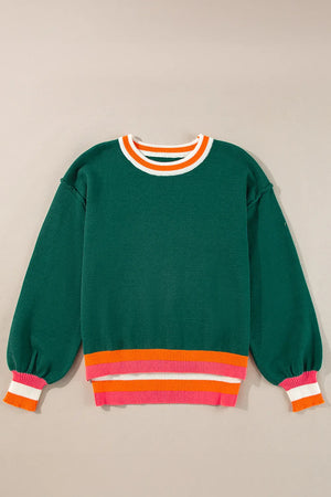 Dark green knit sweater with balloon sleeves and colorblock trim at neckline and hem.