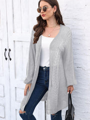 Light gray acrylic cable knit cocoon cardigan with open front and long sleeves.