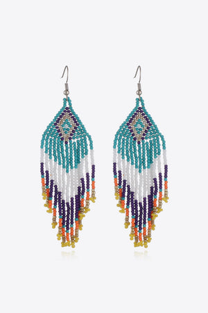 Beaded diamond fringe earrings in turquoise, white, purple, orange, yellow, and gold beads.