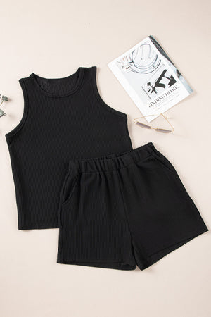Black ribbed tank top and shorts set with elastic waist and pockets.