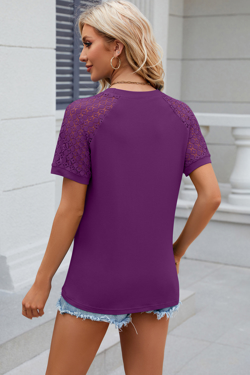 Purple ribbed tee with lace raglan sleeves and crew neck.