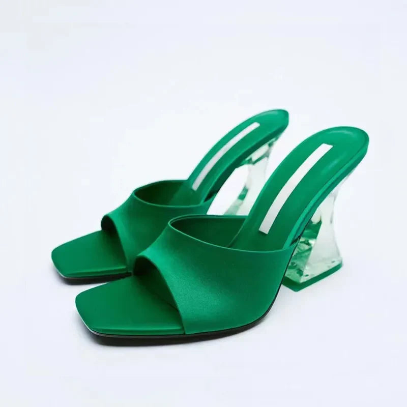 Dark green satin mules with square toe and sculpted clear heels