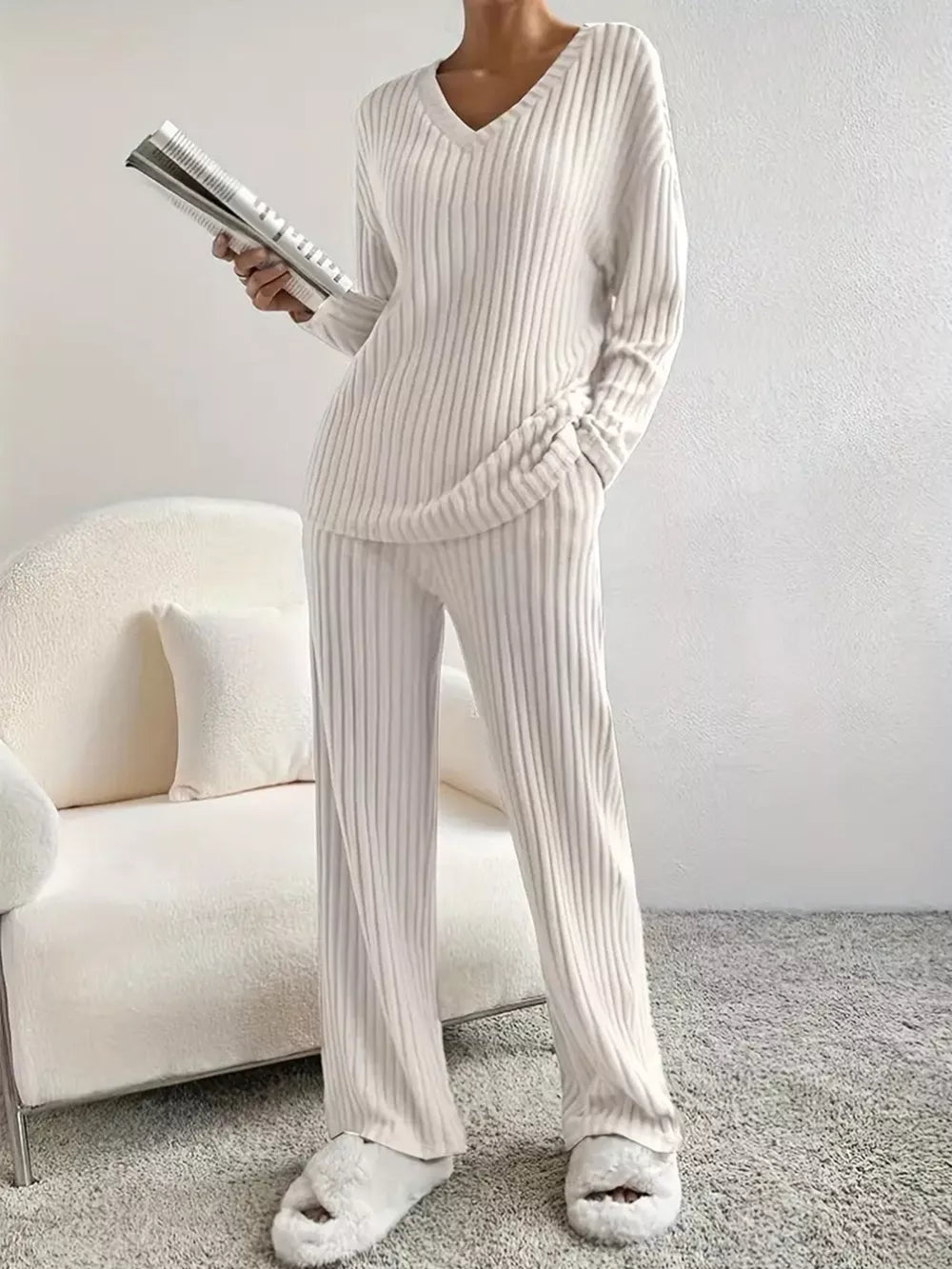 Off-white ribbed knit V-neck loungewear set with long sleeves and wide-leg pants.