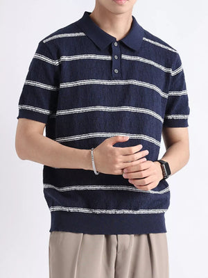Navy striped knit polo shirt with button accents and short sleeves.