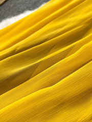 Yellow pleated chiffon halter dress fabric detail
