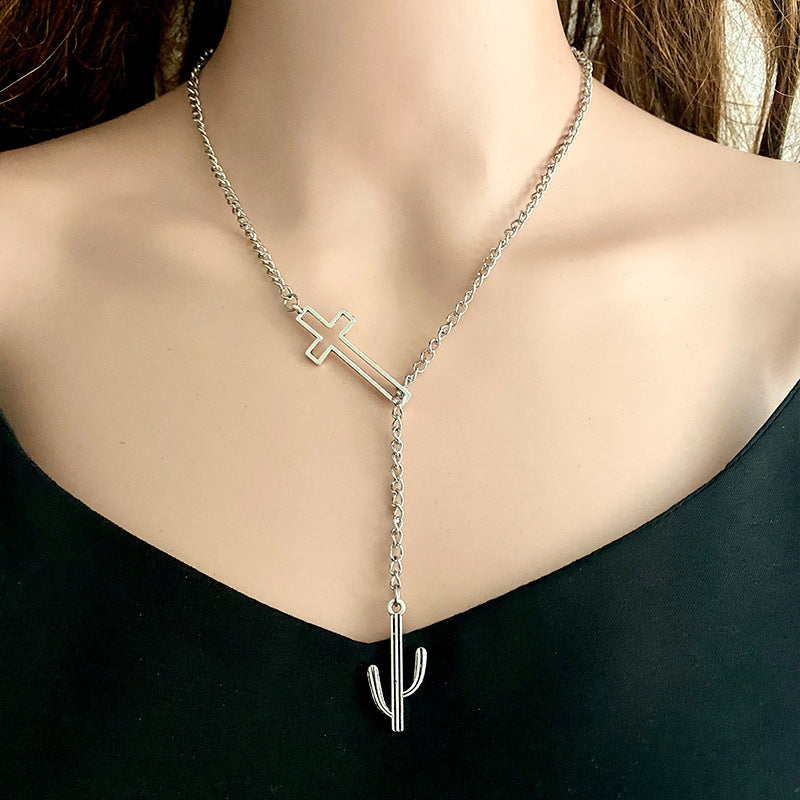 Silver asymmetrical cross lariat necklace with cactus charm, alloy material.