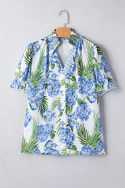 White V-neck blouse with blue hydrangea floral print, ruffled short sleeves, and smocked collar.