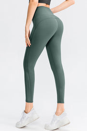 Mesh panel performance leggings in deep teal with a high waist and athletic fit.