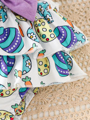 Easter graphic bodysuit and skirt set with carrot and egg print, purple bow detail.