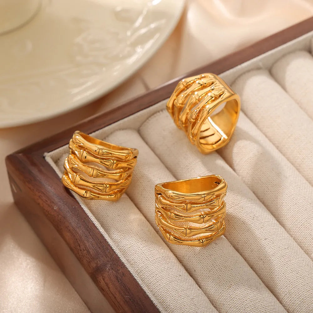 Gold sculptural titanium bamboo ring with stacked segmented design