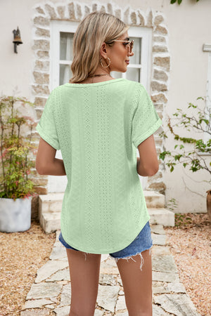 Perforated sleeve tee in light green with rolled cuffs and a curved hem.