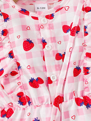 Strawberry print baby jumpsuit with ruffle trim and button front.