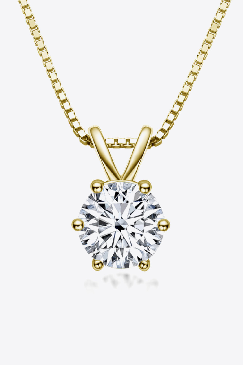 Gold moissanite pendant necklace with 1 carat round brilliant cut stone on a box chain.