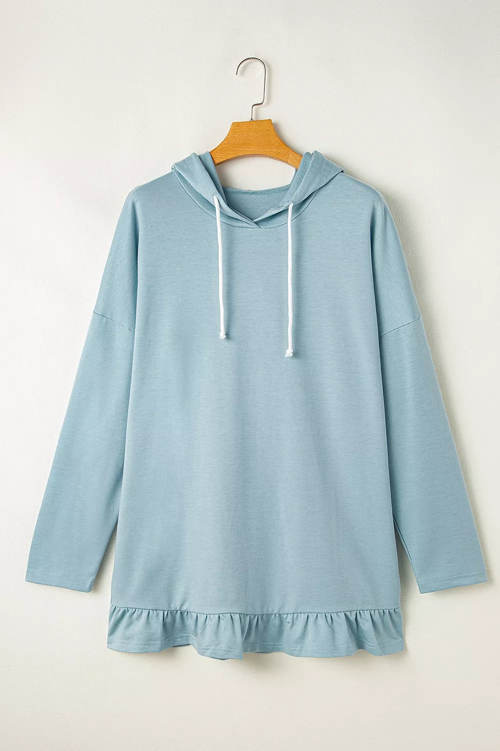 Solid Ruffled Hem Loose Fit Tunic Hoodie in Light Blue, model styling view