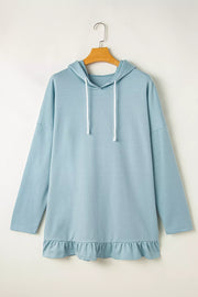 Solid Ruffled Hem Loose Fit Tunic Hoodie in Light Blue, model styling view