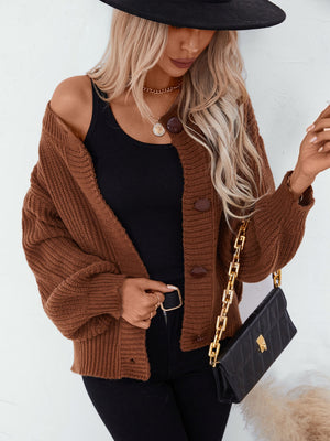 Brown ribbed knit button-up cardigan with balloon sleeves and dark brown buttons.