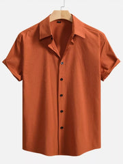 Orange textured Cuban collar casual shirt with short sleeves and button-down front.