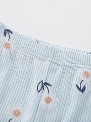 Baby girls' light blue striped pants with a floral print.