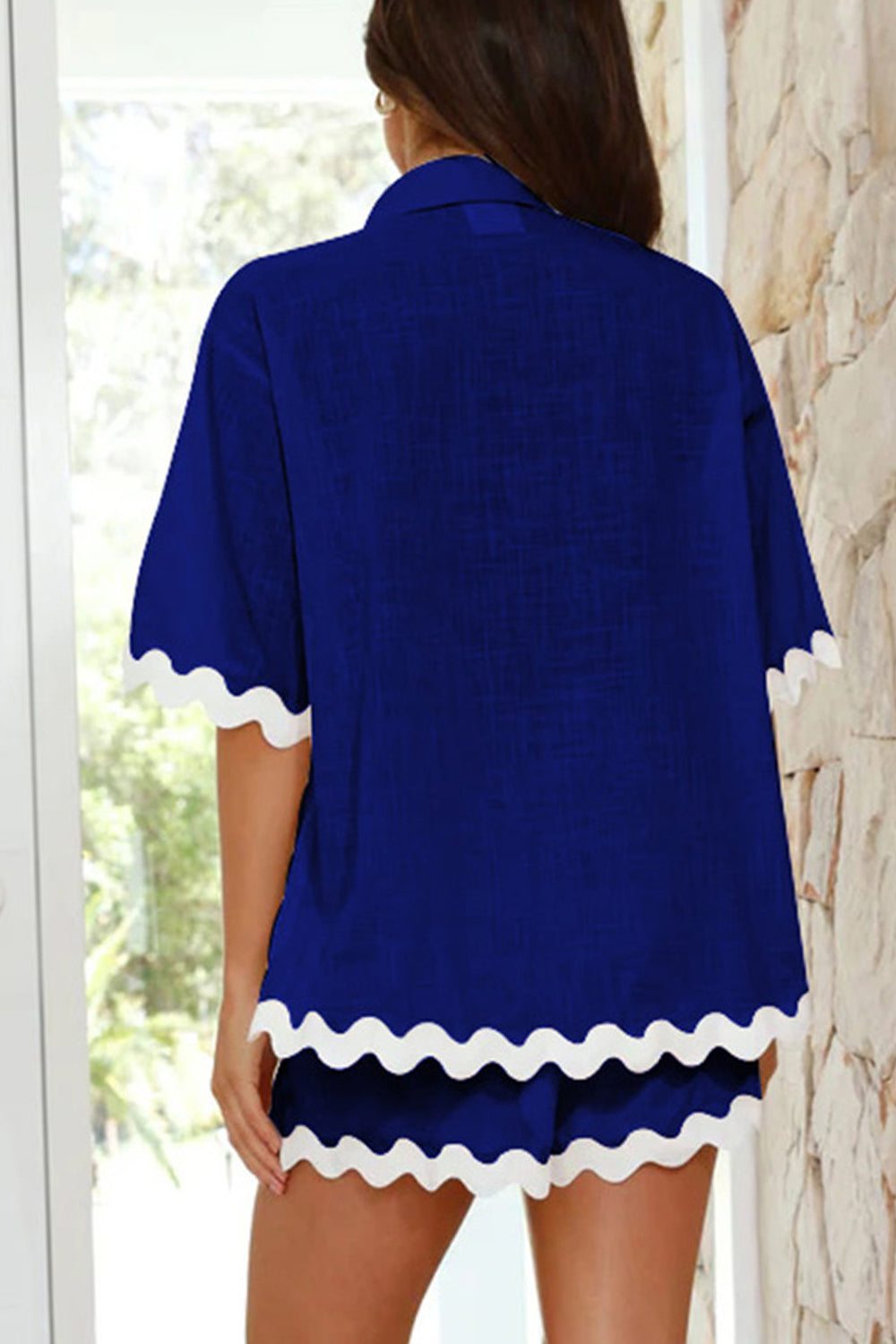 Royal blue co-ord set with white scalloped trim on short sleeves and shorts.
