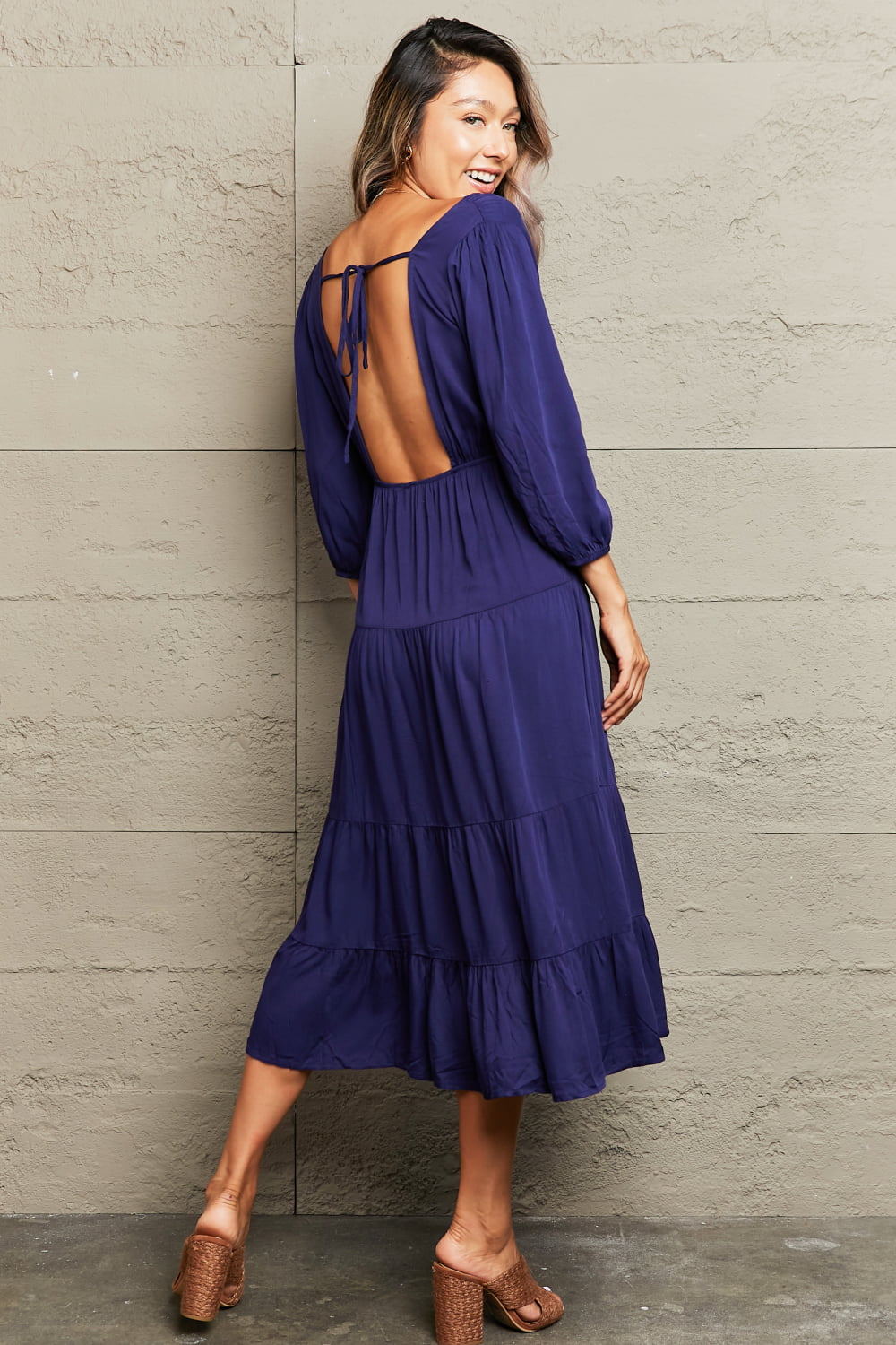 Navy backless empire waist tiered midi dress with balloon sleeves and tie back.
