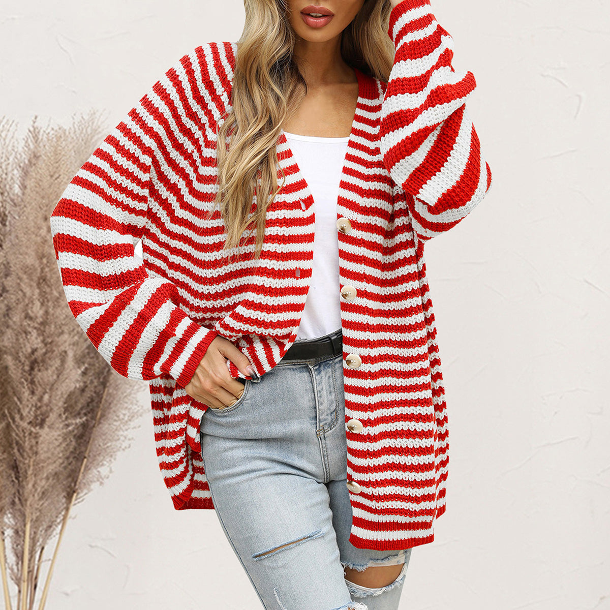Red and white stripe button-up knit cardigan with a relaxed fit.