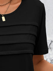 Black jersey top with horizontal pleats on the bodice and crew neck.