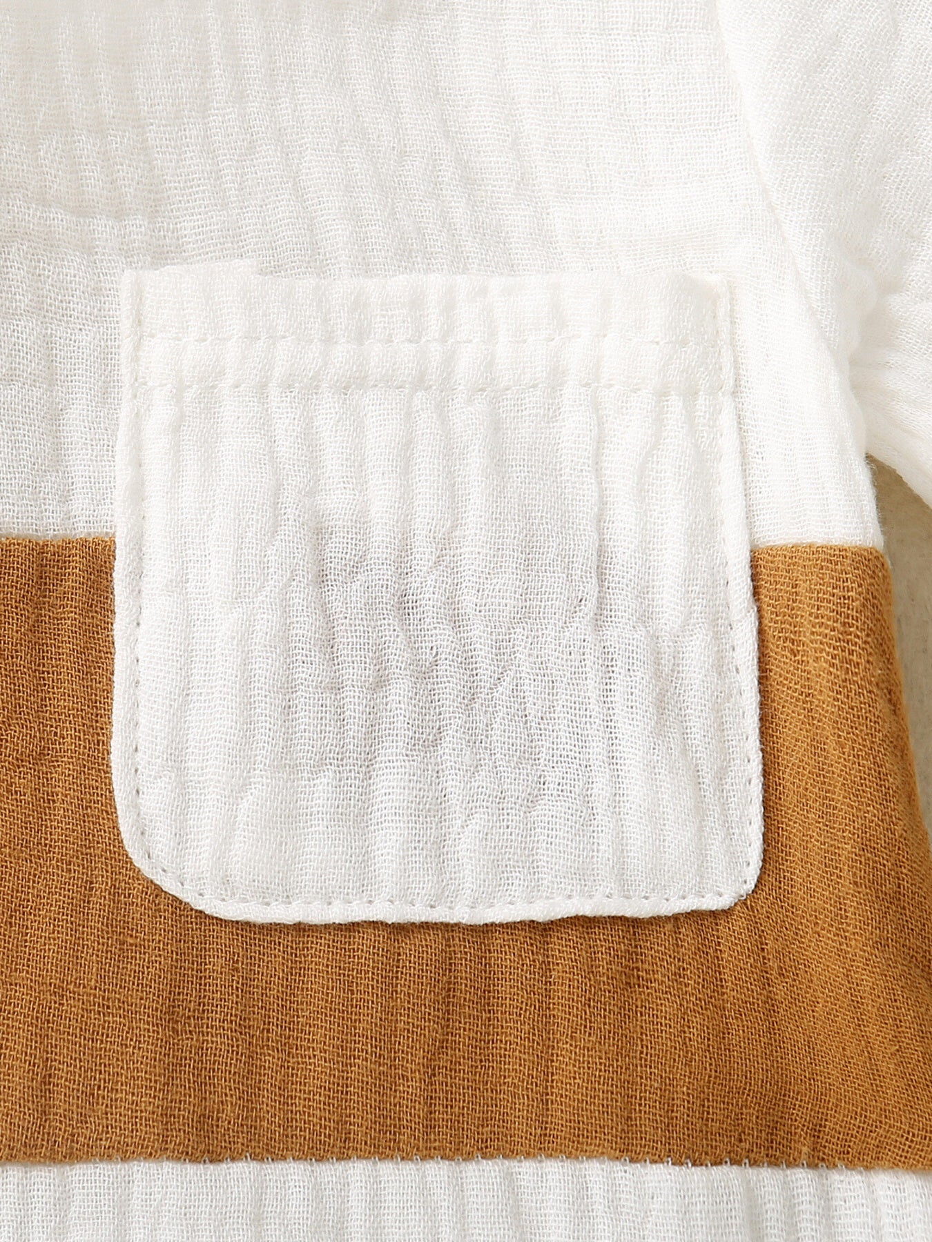 Children's cotton color-block top with white pocket detail and brown accents