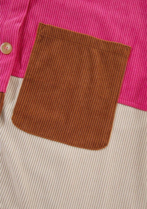 Colorblock corduroy shacket with patchwork pocket in hot pink and tan stripe.